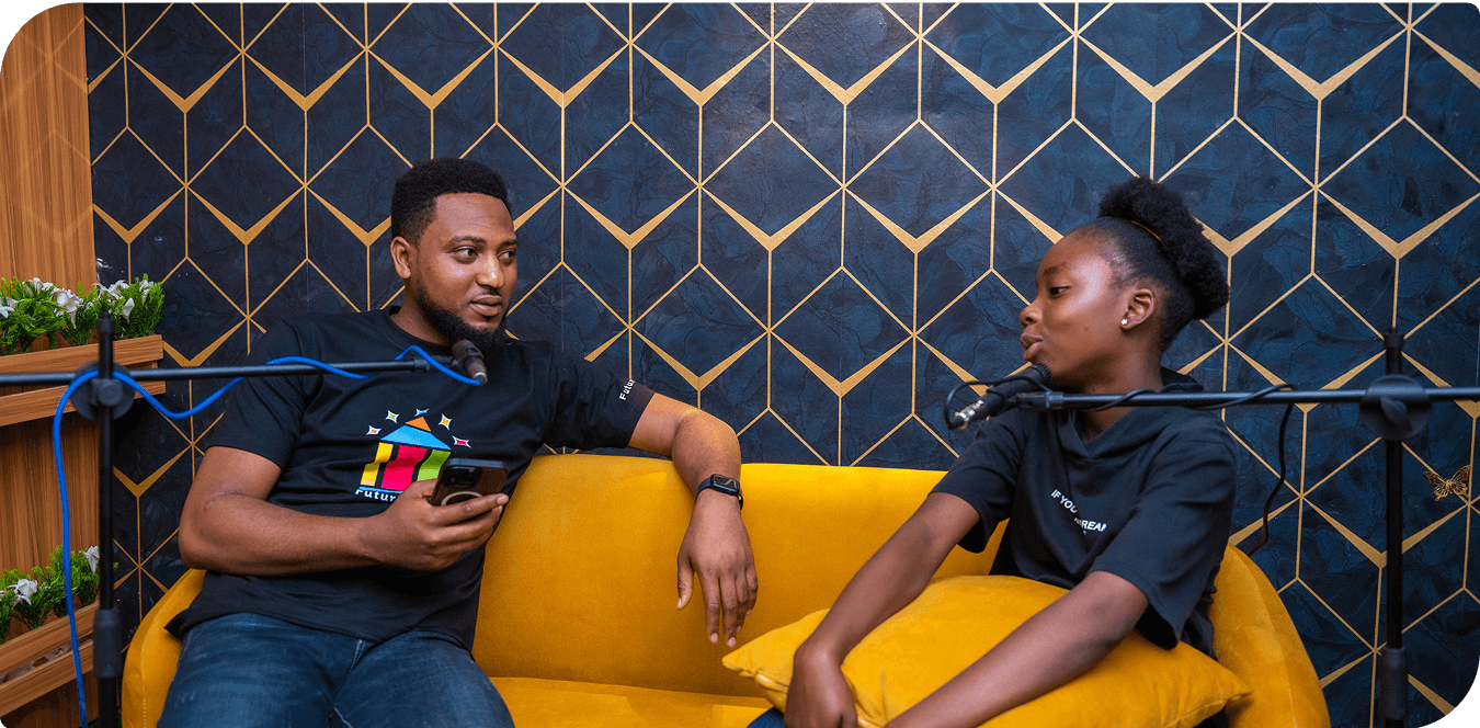 Two people having conversation on yellow couch