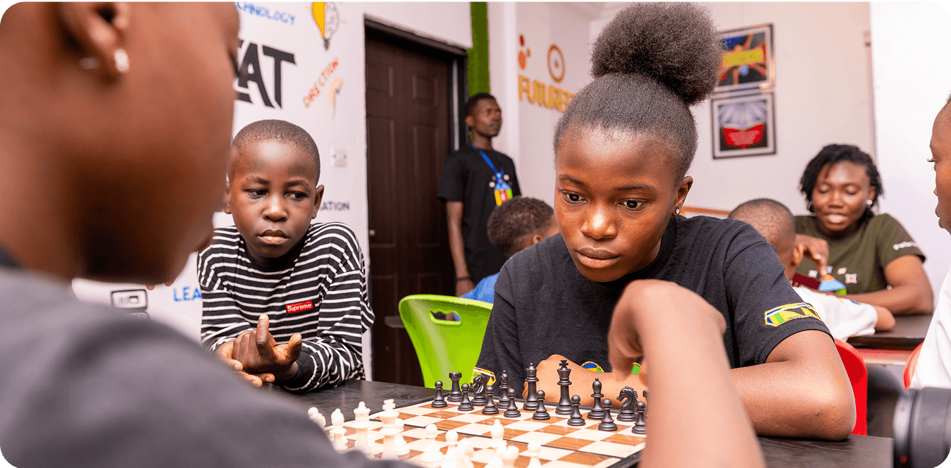 Children playing chess together